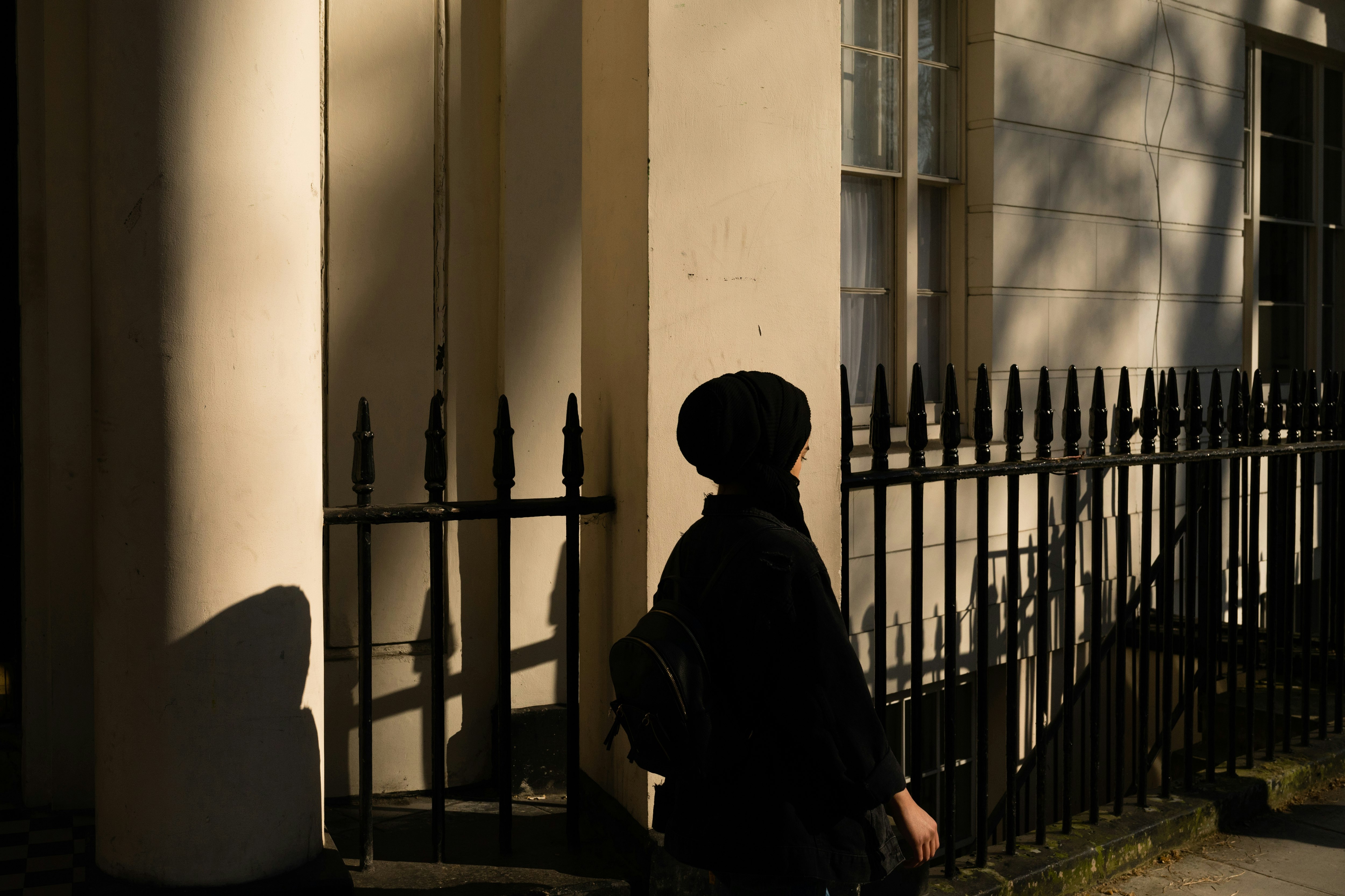 woman walking pass the building